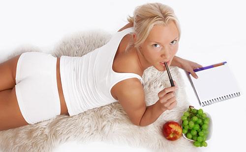 Girl writes something in a notebook