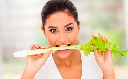 Girl bites celery