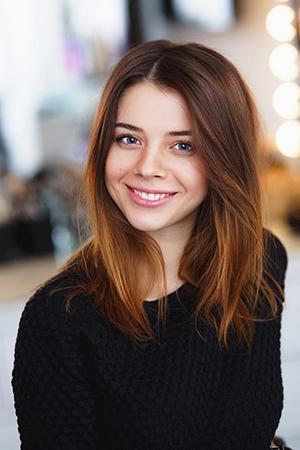 Cute smile of a girl in black