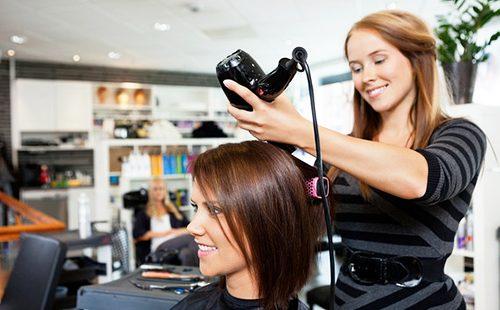 Happy hairdresser has a satisfied client