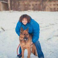 Tatyana with a shepherd walk in the snow