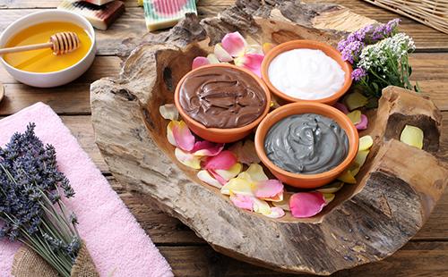 Clay in bowls, herbs and honey prepared for the mask