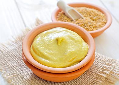 Yellow mustard in clay bowls