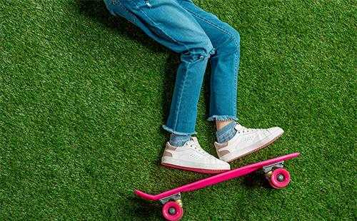 Legs in jeans on the grass