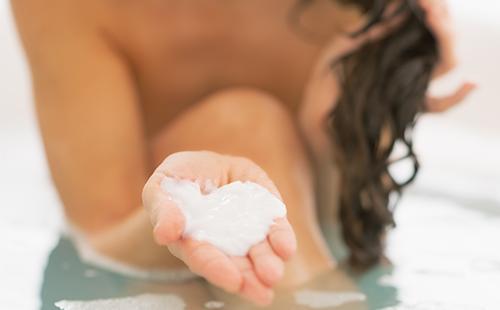 White shampoo in hand