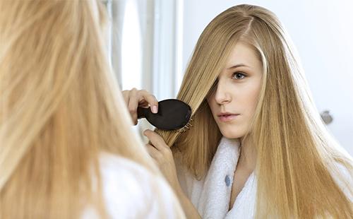 Girl combing her hair