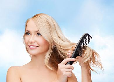 Blonde combing her hair