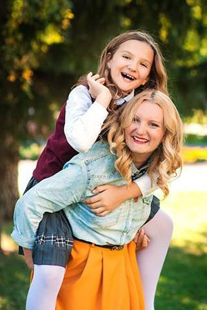 Mom and daughter play in nature