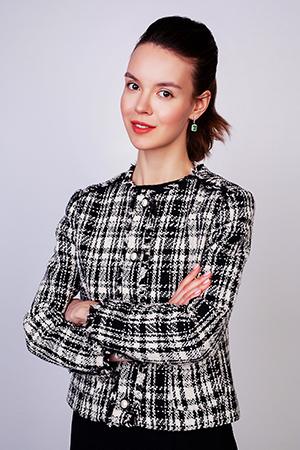 Woman in checkered jacket crossed her arms over her chest.