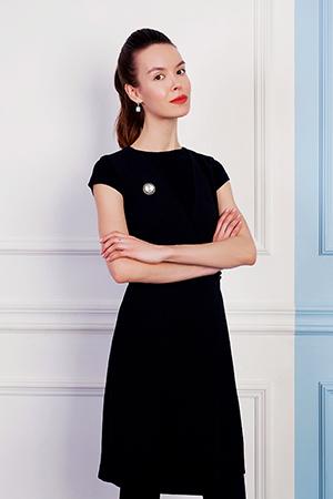 Catherine in a strict black dress