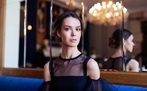 Catherine in a black chiffon dress