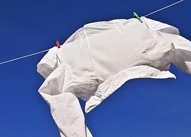Men's shirt rinses in the wind against the sky
