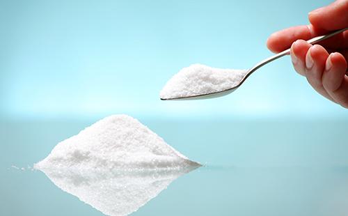 From a heap of salt scooped up with a spoon