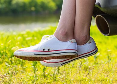 White sneakers on legs