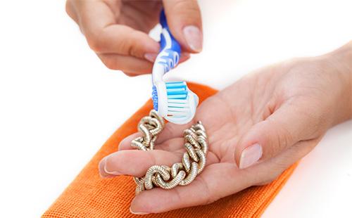 Toothpaste cleaning a silver bracelet