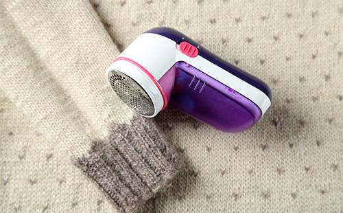 Machine for removing spools from clothes