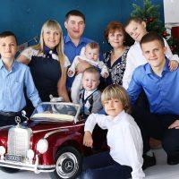 Family photo with a toy car