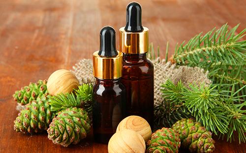 Bubbles with fir oil stand among the cones