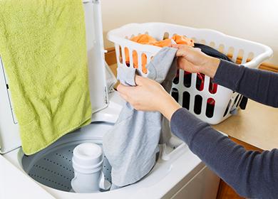 Woman washes hands in the sink