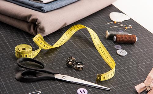 Sewing kit with scissors, meter and cloth