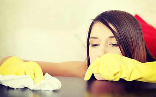 Woman wipes furniture