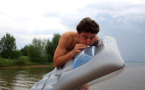 Guy inflates mattress