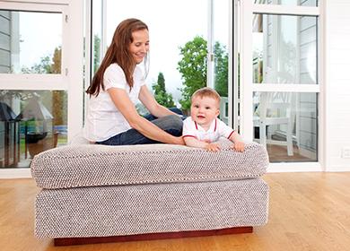 Mom and baby play on the couch