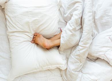 Girls' heels on top of the pillow