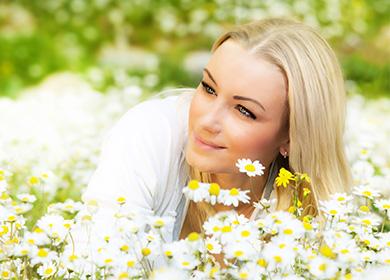 Woman near camomiles