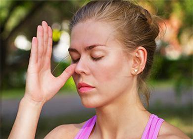 Woman touched her nose with thumb