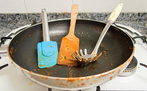 Dirty cauldron and spoons