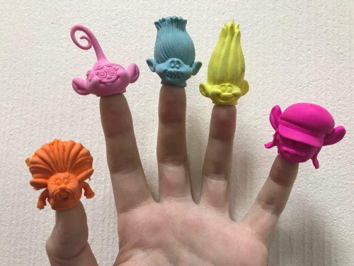 Troll heads on fingers