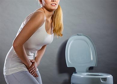 Woman holds on to the lower abdomen