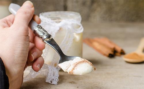 Yogurt with cinnamon in a spoon