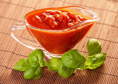 Glass gravy boat and sprig of greens