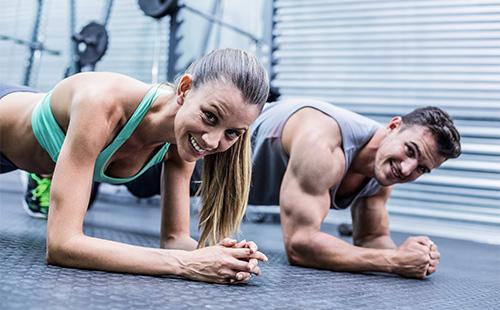 Woman and man stand on plank