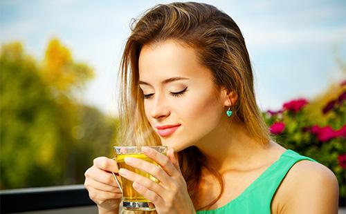 Woman drinking green tea