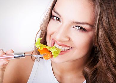 Pretty girl eating salad