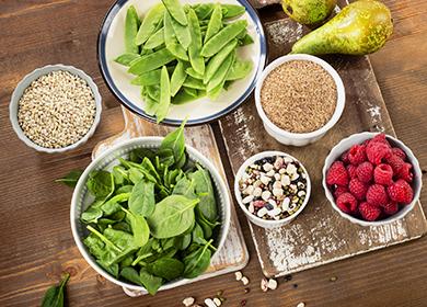 Greens, bran and pear on the table