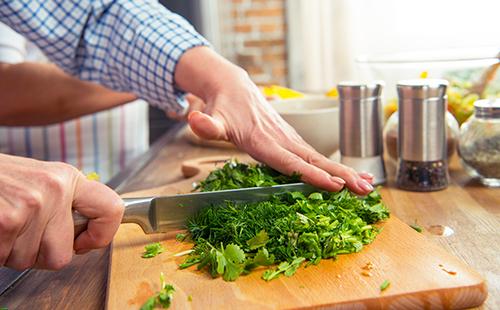 Cutting greens into salad