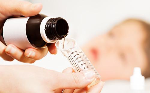 Syrup in a measuring spoon