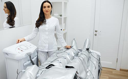Beautician performs pressotherapy