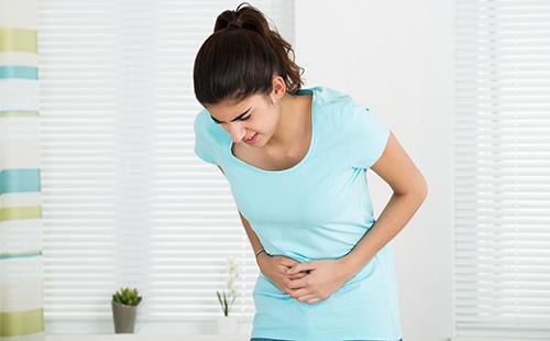 The young girl has a stomach ache