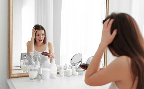 Woman looking in the mirror