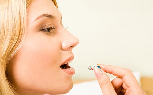 Girl taking medicine