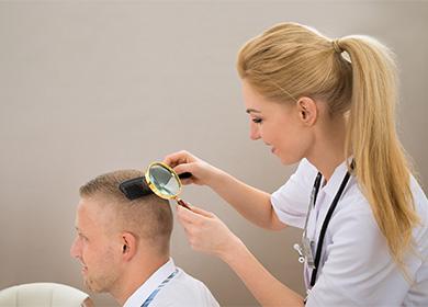 The doctor examines the hairline