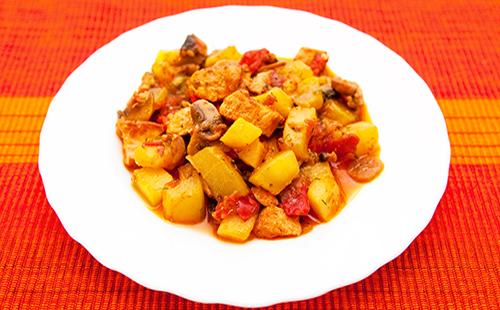 Eggplant and tomato on a white terrel