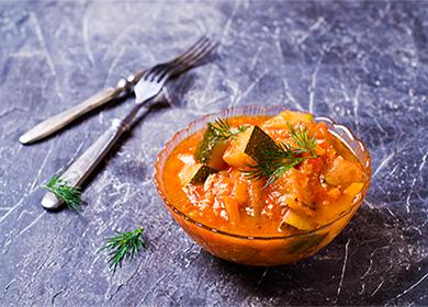 Zucchini lecho in a bowl and cutlery