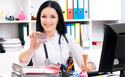 Doctor holds a blister with pills