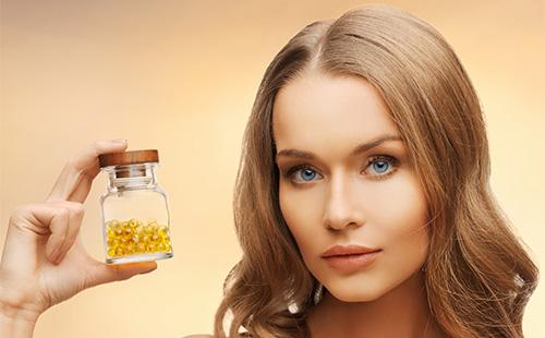 Girl with a bottle of vitamins